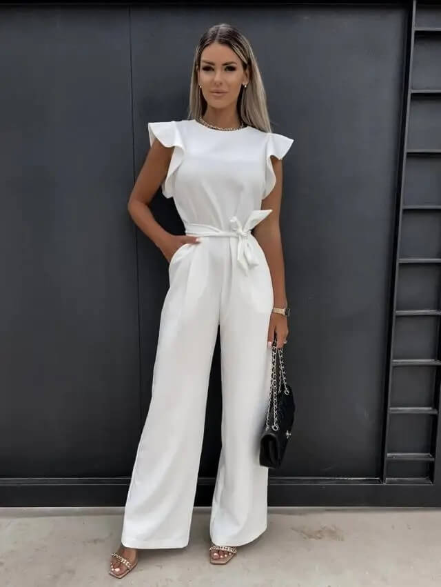 White wide-leg jumpsuit with flutter sleeves and waist-tie belt