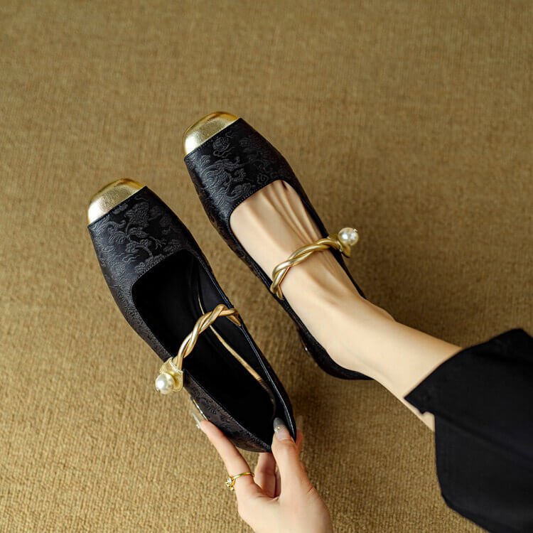 Black Mary Jane flat shoes with twisted strap and pearl button detail, low block heel