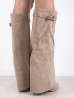 Beige suede knee-high boots with wide top band and gold buckle, block heel