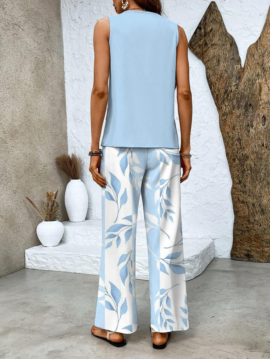 Light blue sleeveless blouse and wide-leg trousers with white-and-blue leaf print