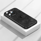 Deer leather iPhone case in black with camera cutouts and deer emblem on the back.