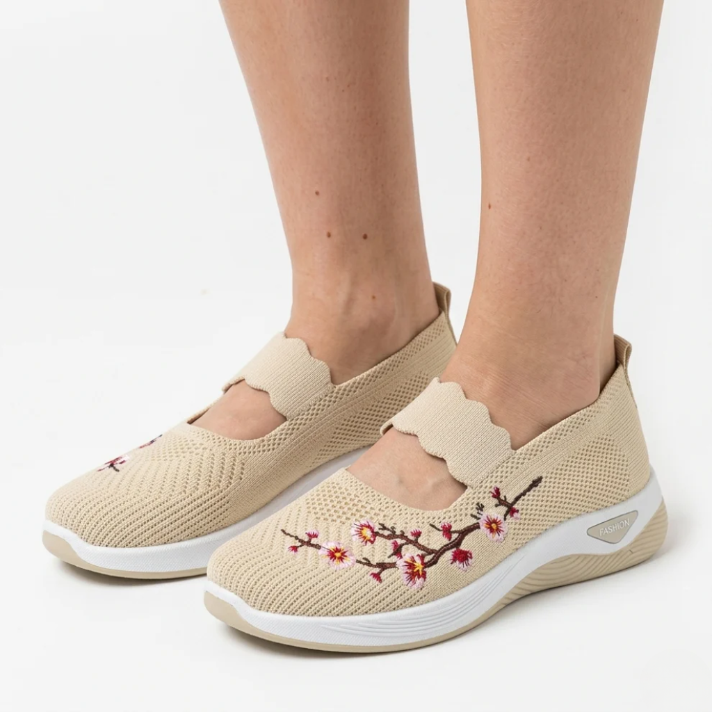 Beige knit slip-on sneakers with floral embroidery and cushioned white sole
