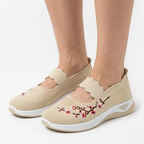Beige knit slip-on sneakers with floral embroidery and cushioned white sole