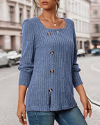 Blue ribbed knit top with square neckline, gold buttons, and side slit hem