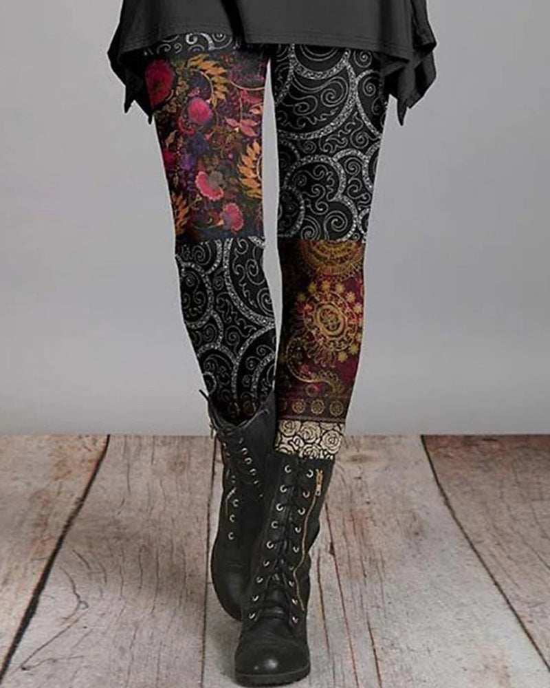 Women's boho leggings with black, gold, and multicolor floral paisley print