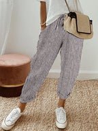 Women’s anti-sweat pants in grey pinstripe, cuffed ankle, drawstring waistband