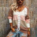 Striped women's sweater in brown and cream with white lace-up front placket.