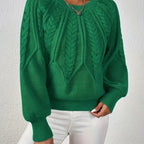 Women’s cable knit sweater with lantern sleeves, green, textured cable knit pattern front.
