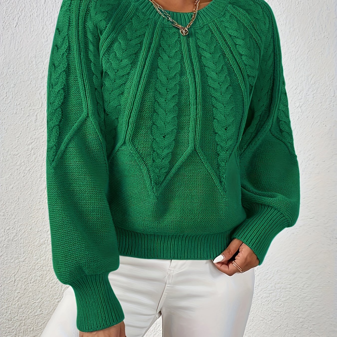 Women’s cable knit sweater with lantern sleeves, green, textured cable knit pattern front.