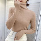 Beige ribbed turtleneck sweater with high neck and long fitted sleeves