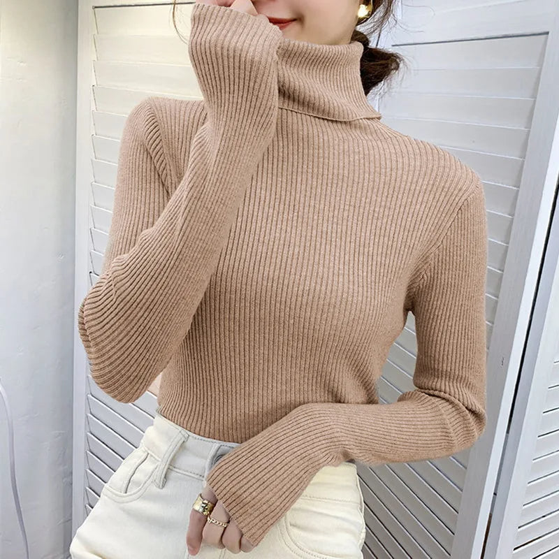 Beige ribbed turtleneck sweater with high neck and long fitted sleeves