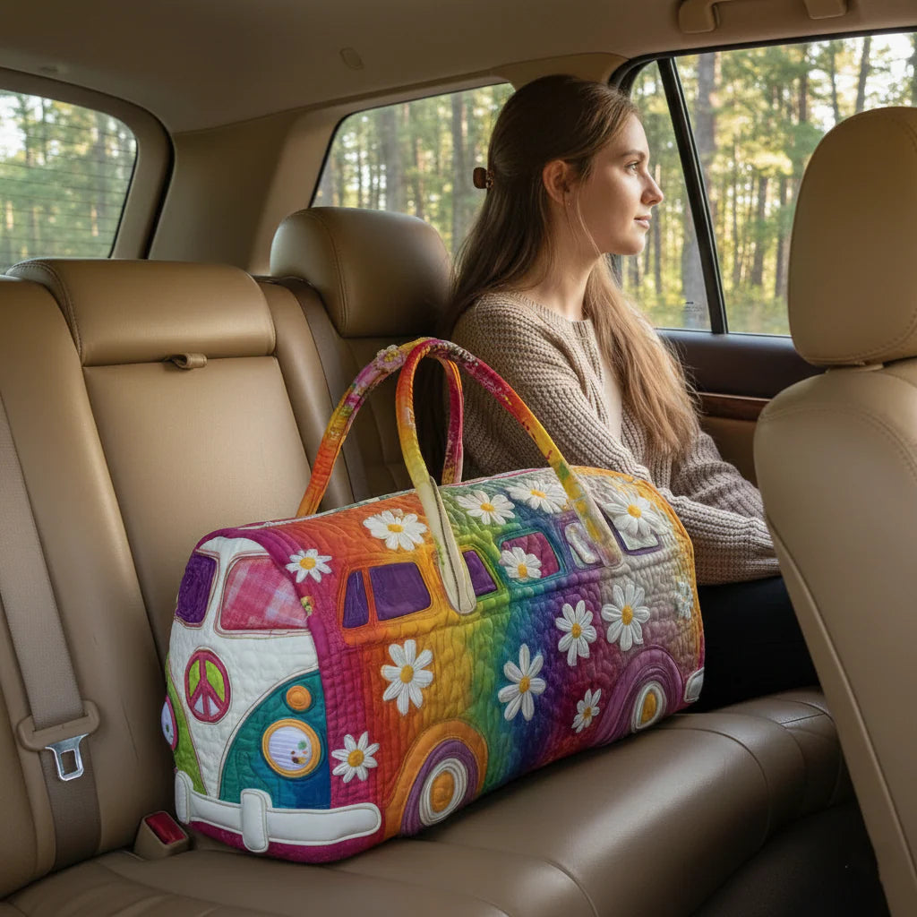 Quilted travel bag with colorful fabric panels, floral appliques, and long carrying handles
