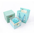 Light blue jewelry gift box set with blue artificial rose in clear square holder
