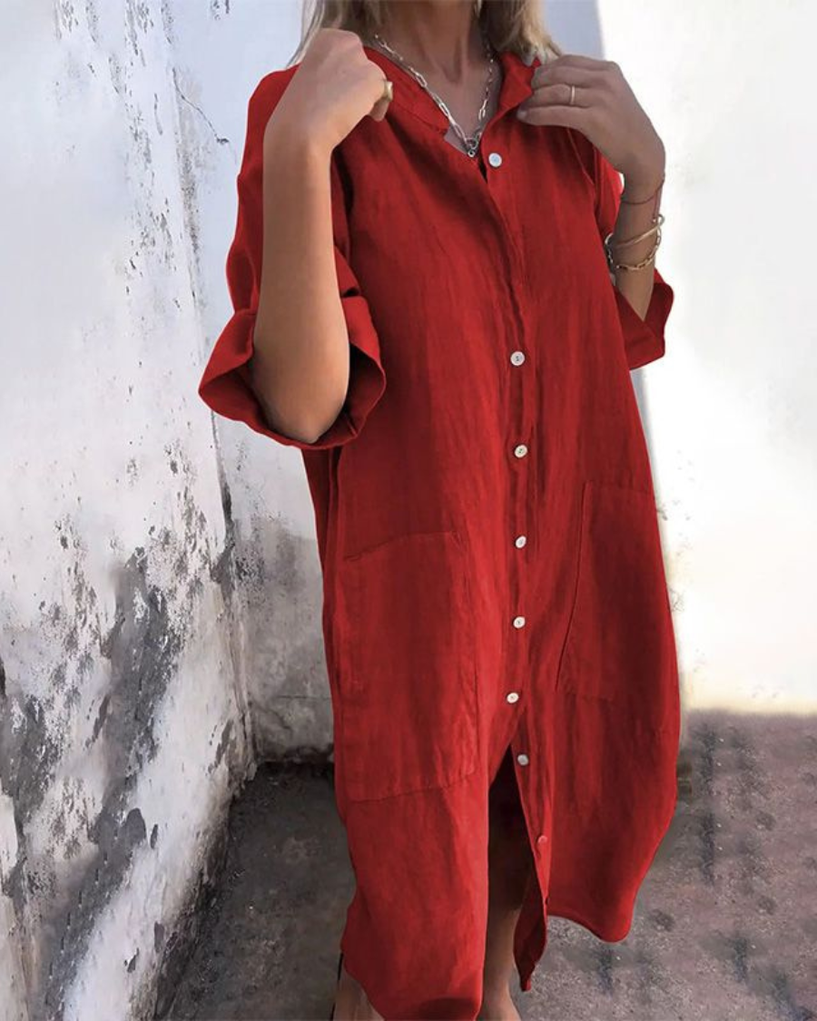 Red button-front shirt dress with chest pocket, short sleeves and curved hem