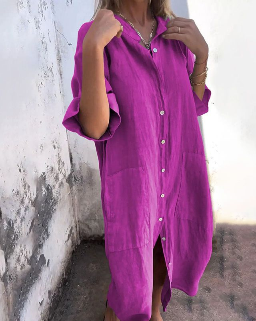 Purple button-front shirt dress with chest pocket and short sleeves, side slit hem