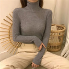 Gray ribbed long-sleeve turtleneck sweater with high neck