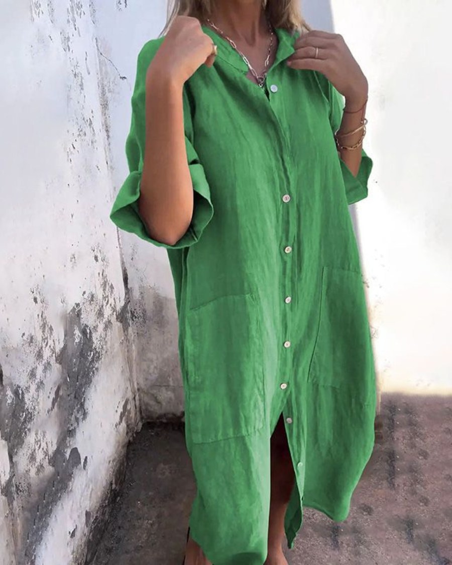 Green button-front shirt dress with chest pocket and short sleeves, curved hem