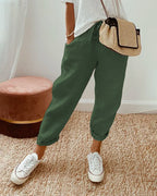Women’s anti-sweat pants in dark green, cuffed ankle, drawstring waistband