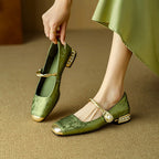 Green Mary Jane flat shoes with twisted strap, pearl button detail, and low block heel