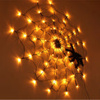 Warm-glow Halloween LED spiderweb lights with black spiders and web strand pattern