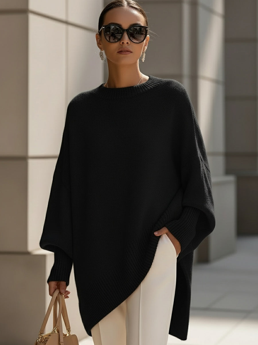 Oversized poncho sweater with ribbed crew neckline, solid black