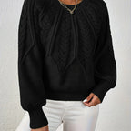 Women’s cable knit sweater with lantern sleeves, black, intricate cable knit front yoke.