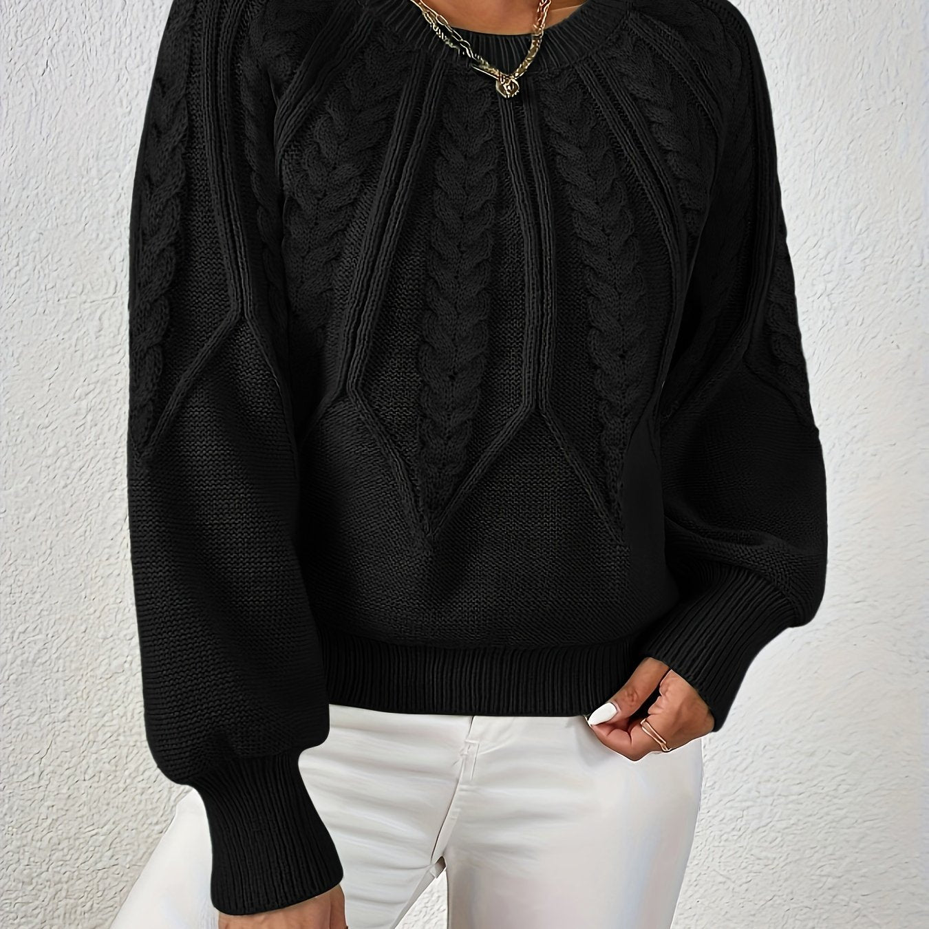 Women’s cable knit sweater with lantern sleeves, black, intricate cable knit front yoke.