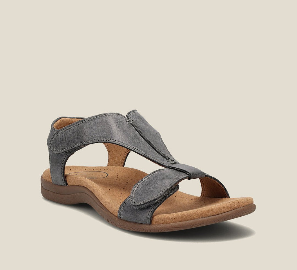 Grey comfort sandals with adjustable cross strap and cushioned footbed
