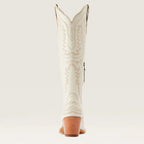 Light-colored embroidered western cowboy boot with stacked heel and pointed toe