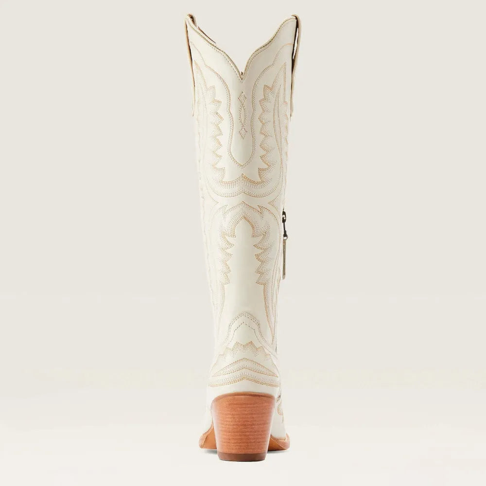 Light-colored embroidered western cowboy boot with stacked heel and pointed toe
