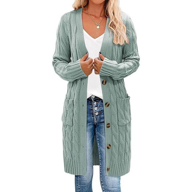 Sage green long knitted vest with button-front and cable texture side pockets.