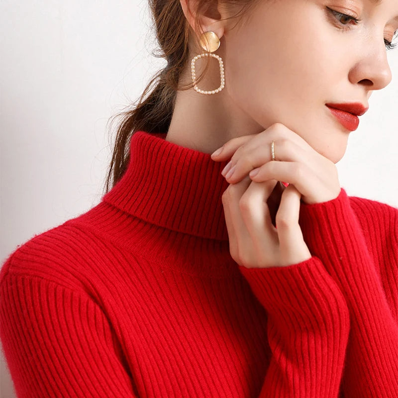 Red ribbed turtleneck sweater with raised collar and long sleeves