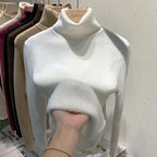 White turtleneck velvet sweater with ribbed collar and soft fuzzy sleeve detail