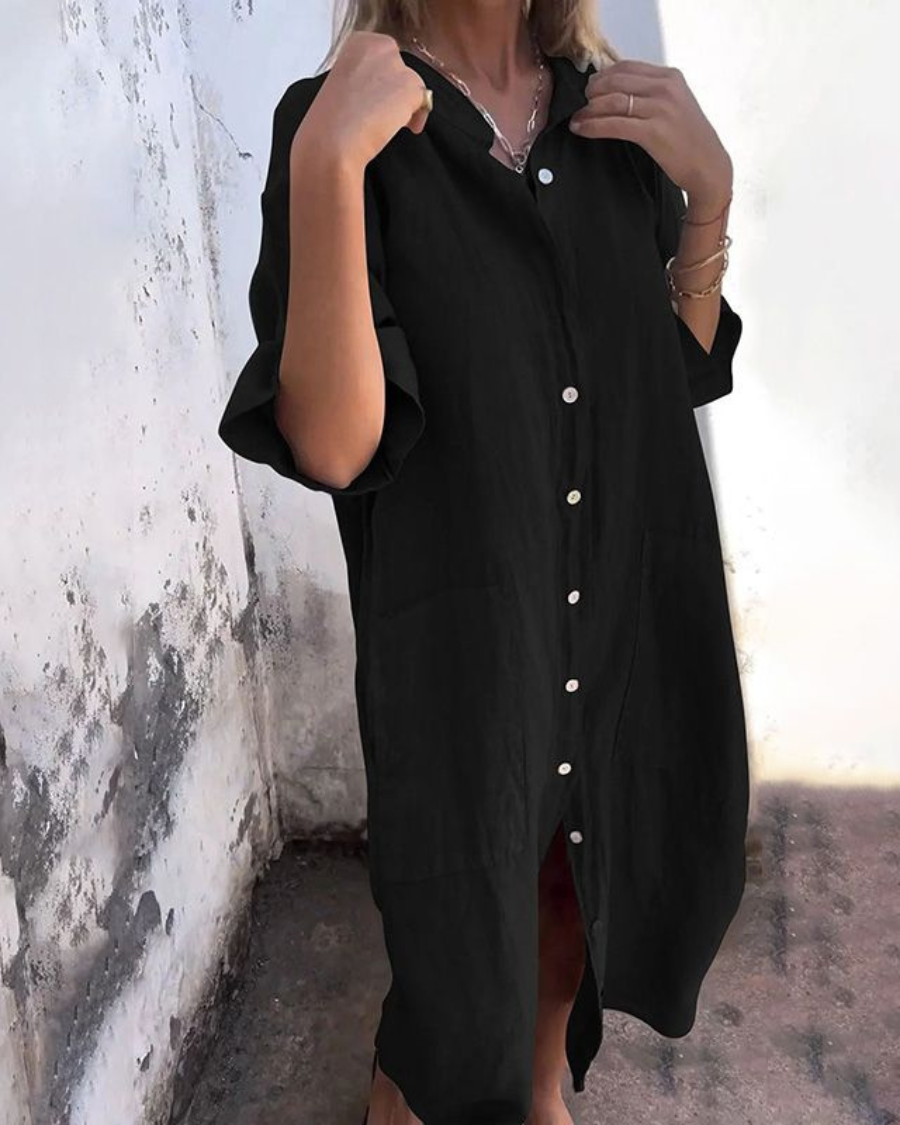 Black button-front shirt dress with chest pocket, short sleeves and curved side hem