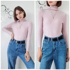 Light pink ribbed long-sleeve turtleneck sweater