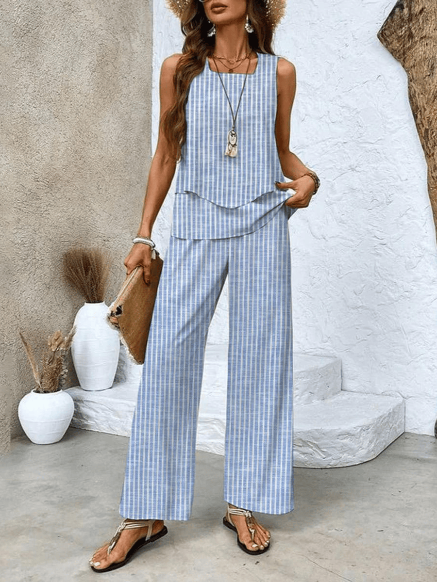 Light blue sleeveless blouse and wide-leg trousers in vertical blue stripe pattern