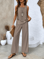 Taupe wide-leg trousers with sleeveless patterned top in brown and black tones