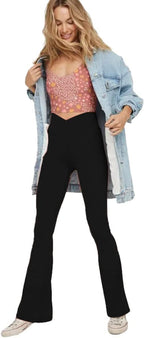 Black flared yoga leggings, high-rise waistband and wide bootcut silhouette