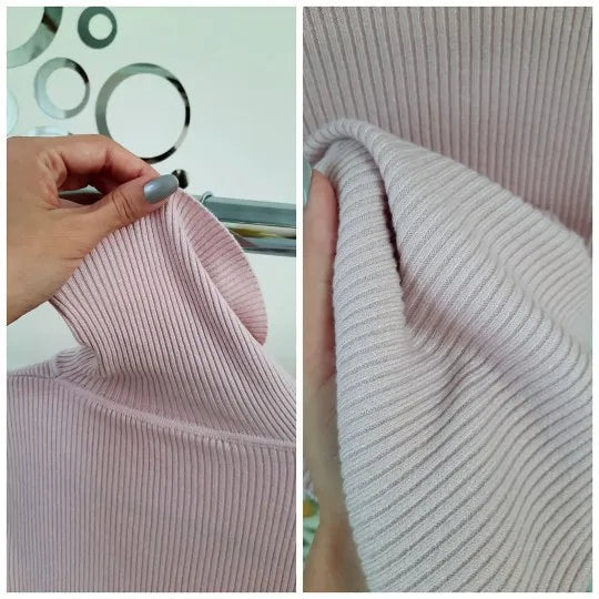 Pale pink ribbed turtleneck sweater sleeve knit detail