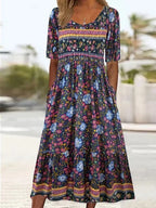 Boho print midi dress with scoop neckline, gathered skirt, and colorful border hem