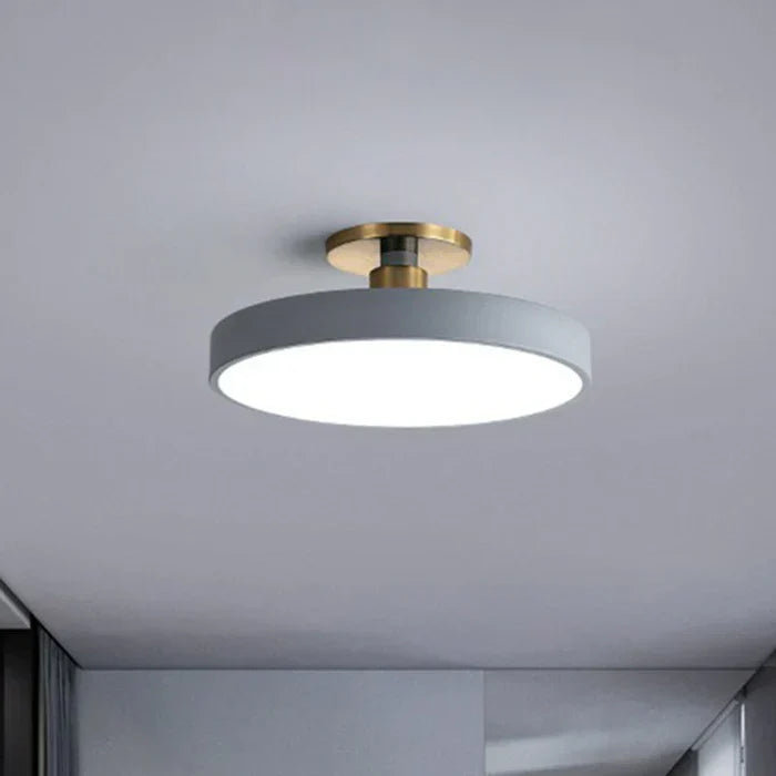 Round flush-mount LED ceiling lamp, gray shade with gold base and wide white glow