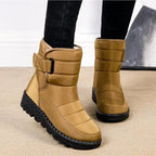 Women's tan quilted mid-calf boots with buckle strap and rugged black tread