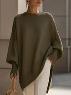 Women's oversized poncho sweater in olive green with ribbed trim and wide sleeves
