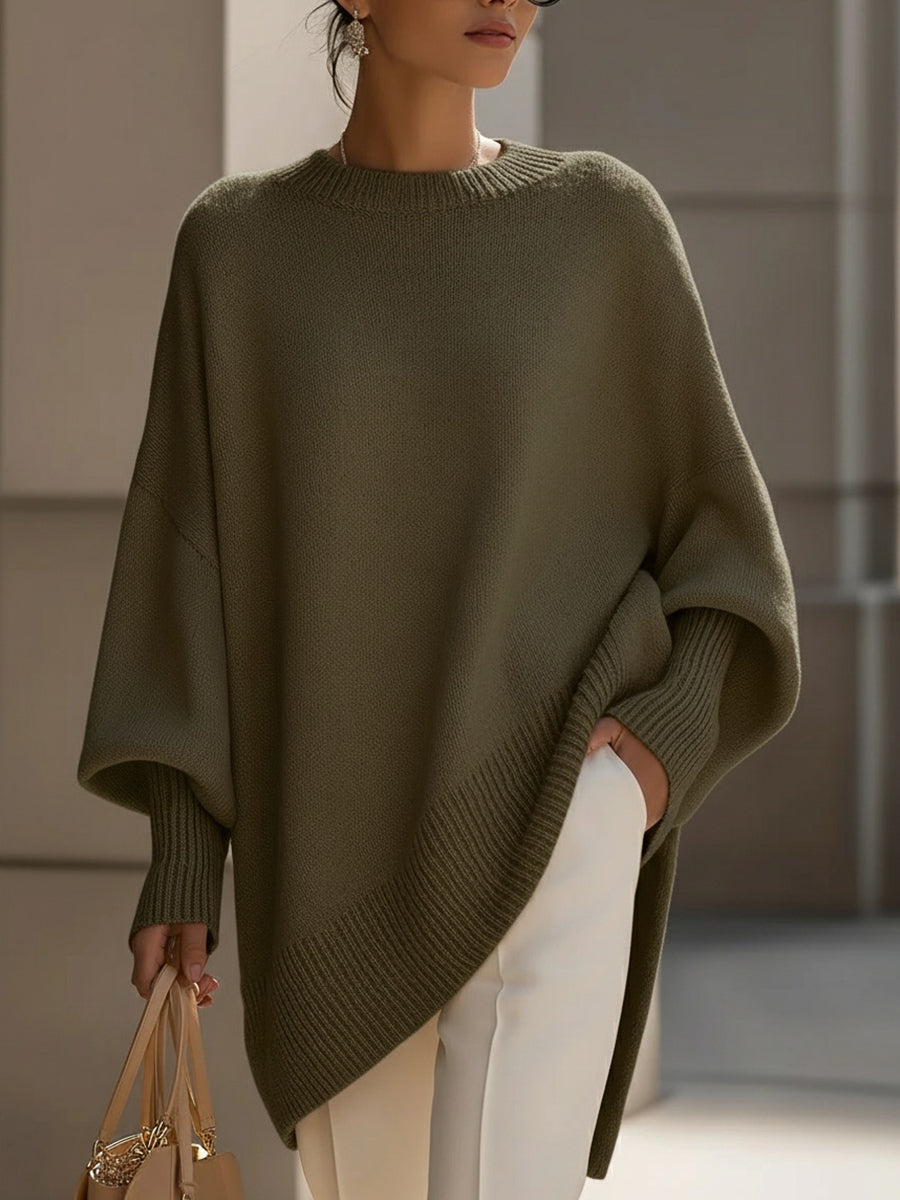 Women's oversized poncho sweater in olive green with ribbed trim and wide sleeves
