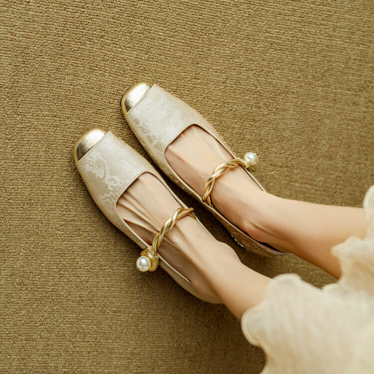 White Mary Jane flat shoes with twisted strap and pearl button detail, low block heel