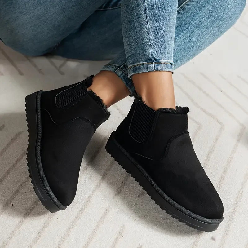 Black suede low-cut slip-on boots with side elastic gore and faux-fur lining