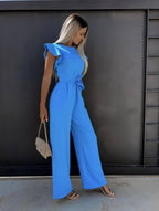 Blue wide-leg jumpsuit with flutter sleeves and waist-tie belt, side view