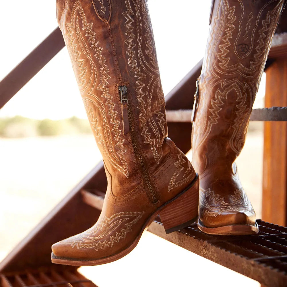 Brown western cowboy boots with detailed embroidery and side zipper, wooden heel