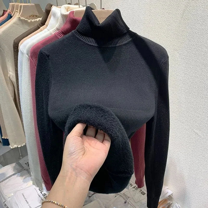 Black turtleneck velvet sweater with ribbed collar and fuzzy sleeve cuff