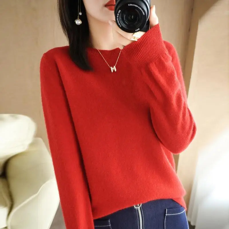 Red crewneck pullover sweater with long sleeves and ribbed cuffs and hem